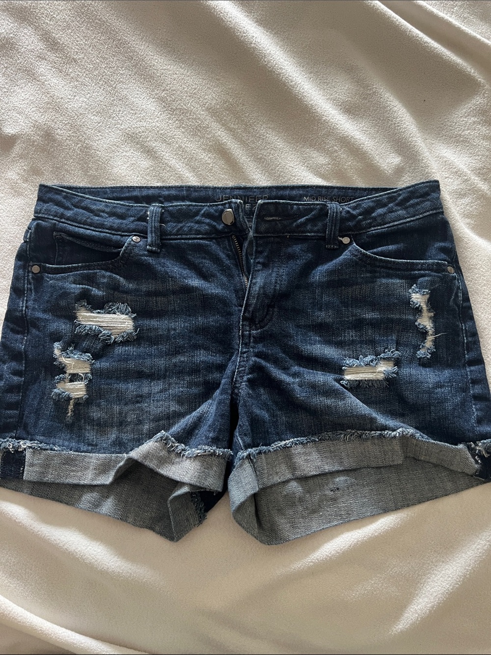 Jennifer Lopez mid rise denim shorts